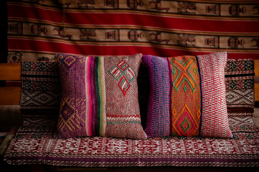 Finished handwoven frazada pillow covers displayed together